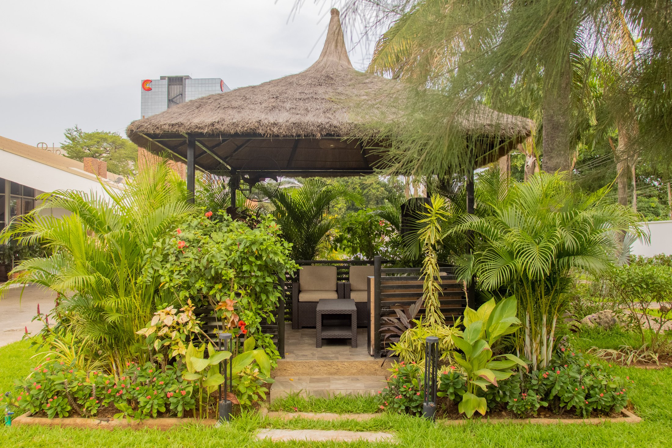 Pavilion framed by tropical planting